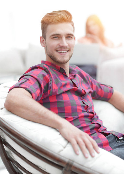 closeup of a successful young man sitting in a comfortable chair - Foto, afbeelding