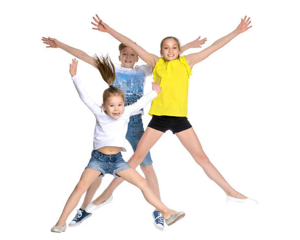 A group of children jumping and waving. - Foto, Imagen