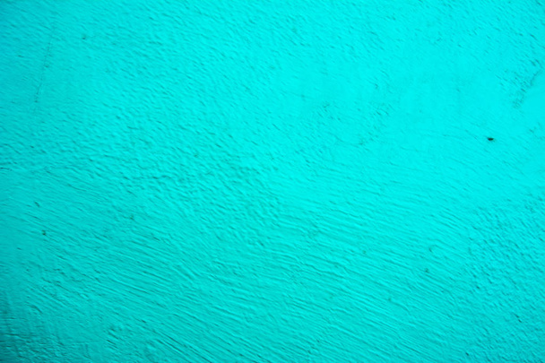 Muur geschilderd in blauw textuur. Naadloze textuur voor een lichte bleke groene betonnen muur. Abstracte achtergrond. - Foto, afbeelding