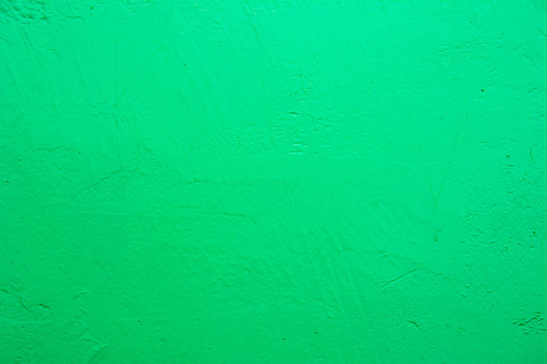 Muur geschilderd in blauw textuur. Naadloze textuur voor een lichte bleke groene betonnen muur. Abstracte achtergrond. - Foto, afbeelding
