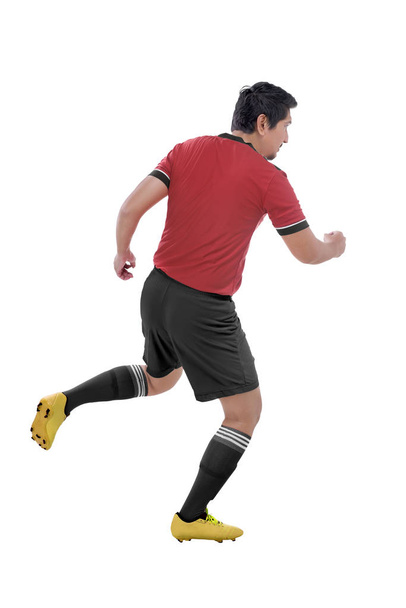 Portrait of asian athlete playing soccer isolated over white background - Φωτογραφία, εικόνα