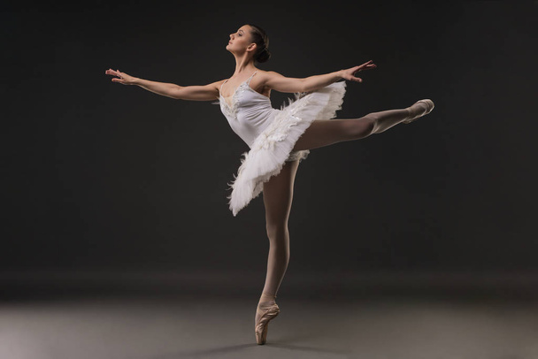 Beautiful ballerina dancing profile view - 写真・画像