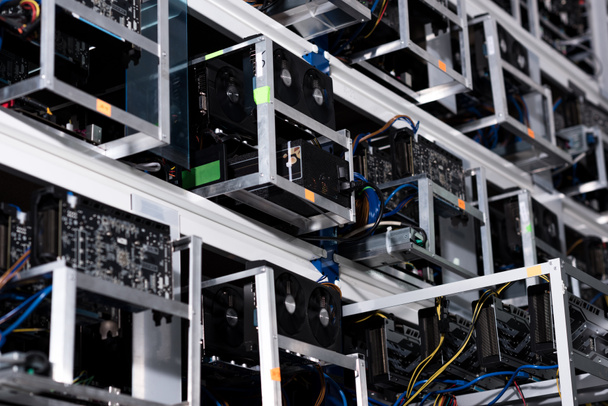 bottom view of shelves with equipment at ethereum mining farm - Photo, Image