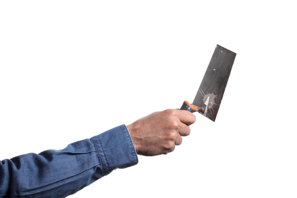 man's hand holding a trowel on white background with clipping path and copy space - Photo, Image