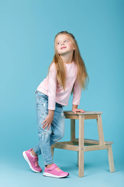 little girl in pink sweater - Фото, изображение