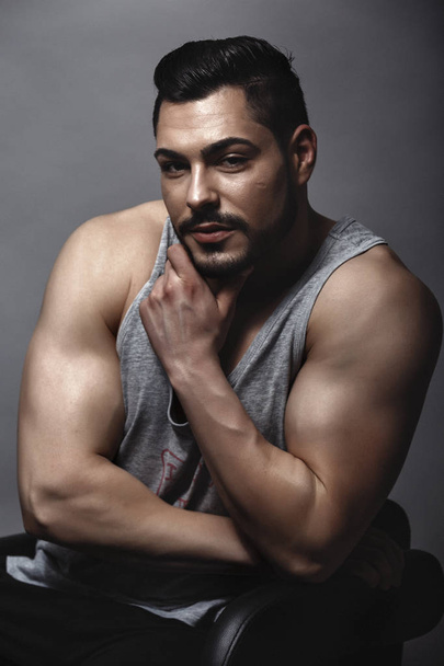 Handsome muscular man posing in studio - Photo, Image