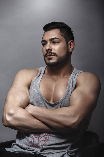 Handsome muscular man posing in studio - Photo, Image
