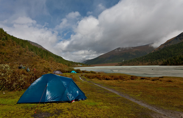 Wet tent at the river bank - 写真・画像