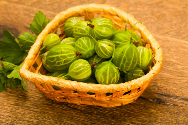 Gooseberries in the bowl with leaf - Photo, Image