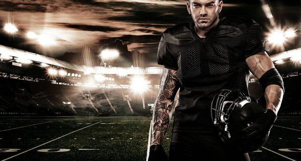 American football sportsman player on stadium. Sports banner and wallpaper with copyspace. - Foto, immagini