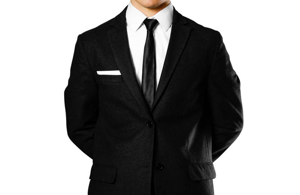 Бизнесмен в черном костюме, белой рубашке и галстуке. Стрельба в студии
 - Фото, изображение