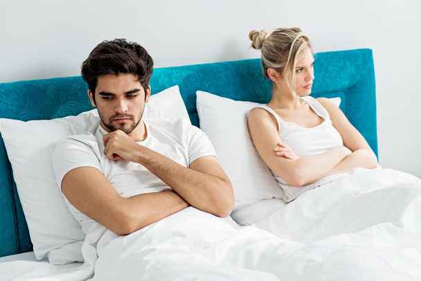 Young couple on the bed; problems in the bedroom   - Photo, Image