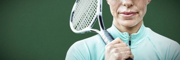Tennisman against green background - Φωτογραφία, εικόνα
