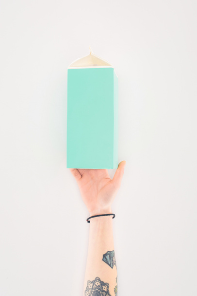 cropped shot of woman holding cardboard milk package isolated on white - Photo, Image