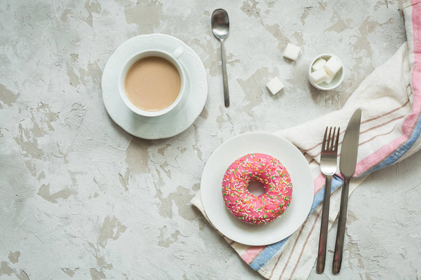 Donut with frosting and coffee - Фото, изображение