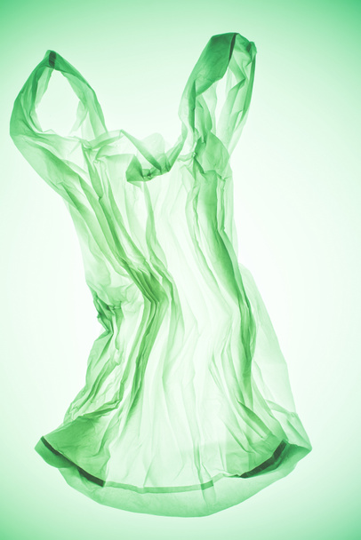 crumpled transparent plastic bag under colorful green light - Photo, Image