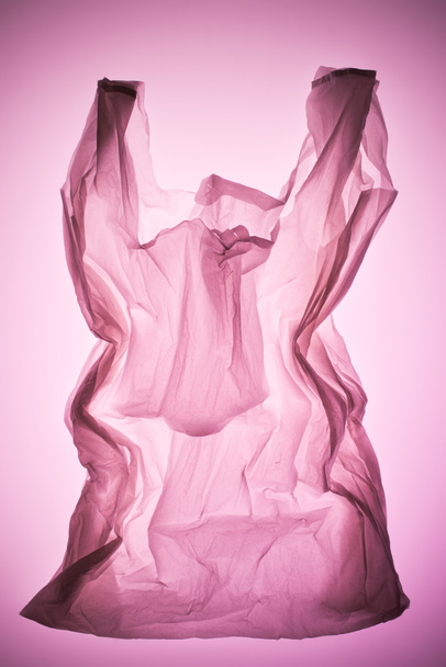 crumpled plastic bag under pink toned light - Foto, Imagem