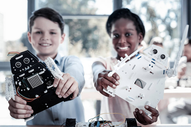 Excited schoolchildren posing with their robots together - Fotografie, Obrázek