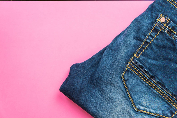 Blue jeans on pink pastel background - Foto, immagini