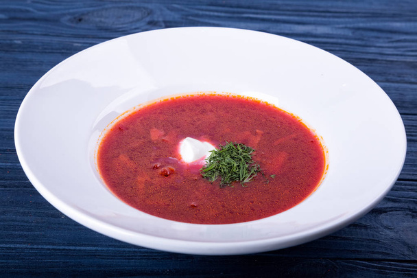 Red borsch in a white plate - 写真・画像