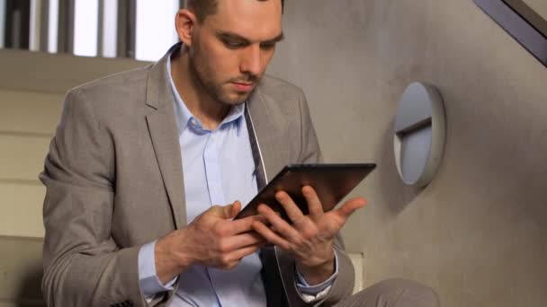businessman with tablet pc at office stairs - Video, Çekim