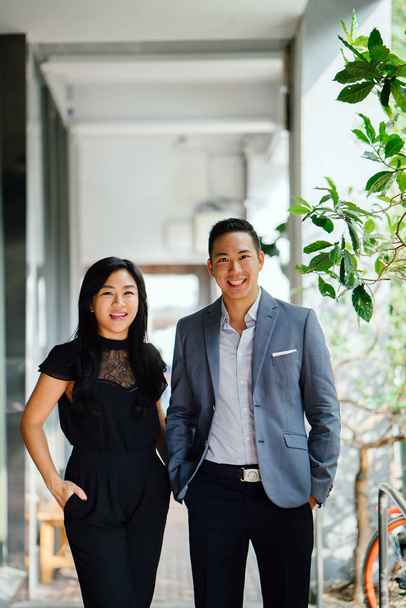 portrait of two professional business people  in Asia. The man and woman are both professionally dressed. - Fotografie, Obrázek