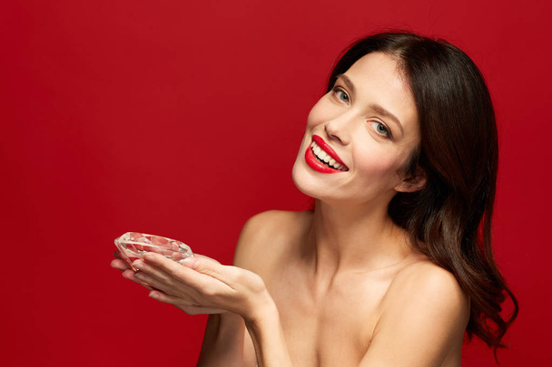 beautiful woman with red lipstick holding diamond - Fotoğraf, Görsel