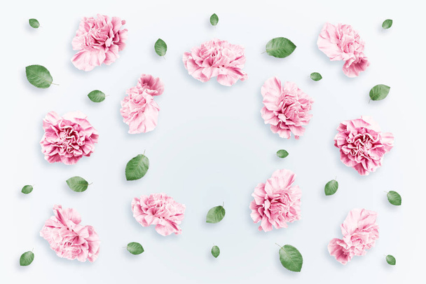 Pattern of pink and beige roses and green leaves on a white background. flat lay, top view, Mixed media. Spring background, Valentine's day, March 8 - Photo, image