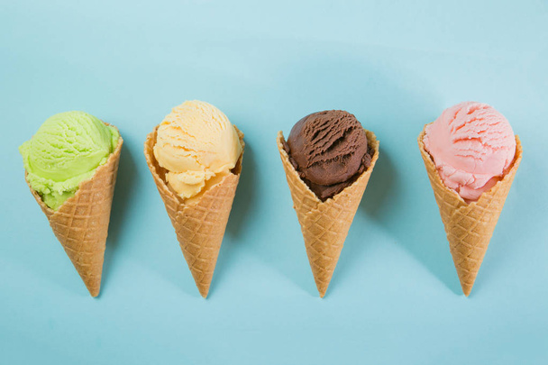 Selection of colorful ice cream scoops on blue background - Foto, Imagem