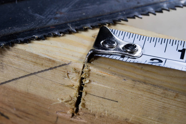 Measuring tools in a carpentry workshop. Steel measuring tape on - Foto, imagen