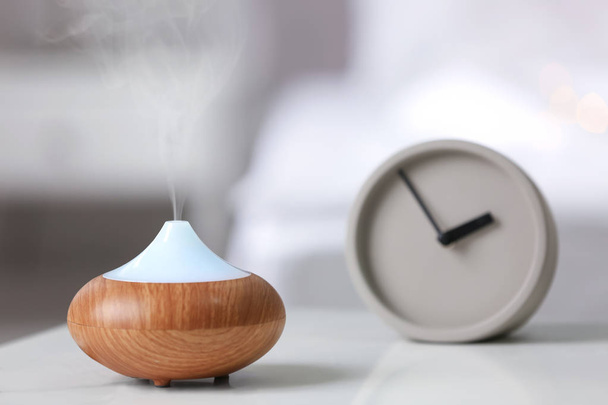 Humidifier on table at home - Фото, изображение