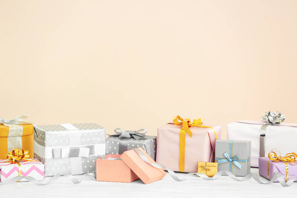 Elegant gift boxes on table against light background - Photo, Image