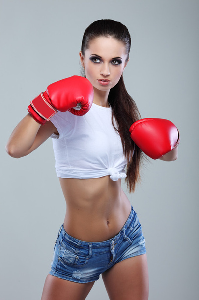 Beautiful sexual boxing girl, fitness, on a grey background - Foto, immagini