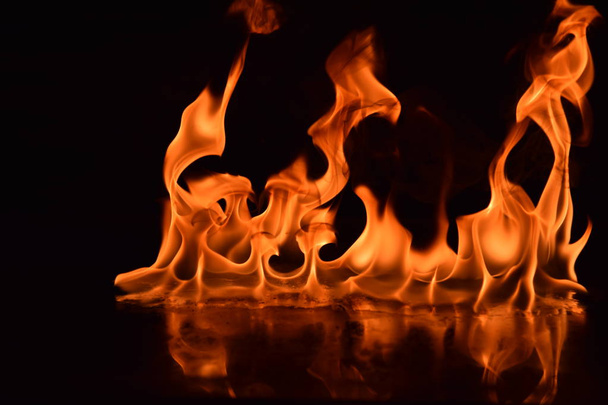 Abstract Fire flames isolated on black background - Foto, afbeelding