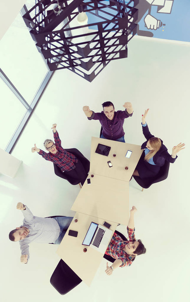 top view of multi ethnic startup business people group on brainstorming meeting in modern bright office interior - Fotó, kép