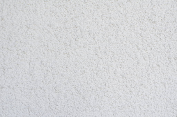 Background of a white stucco coated and painted exterior, rough cast of cement and concrete wall texture, decorative coating  - Photo, Image