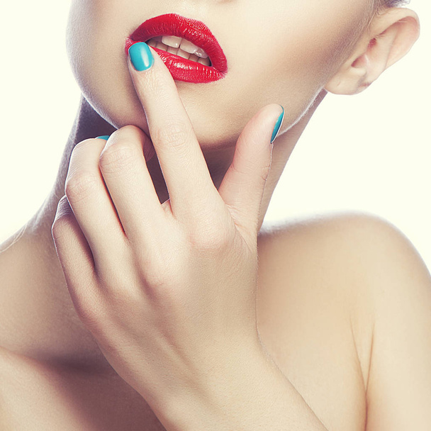 Partial view of woman portrait with red lips and blue nail polish - Foto, immagini