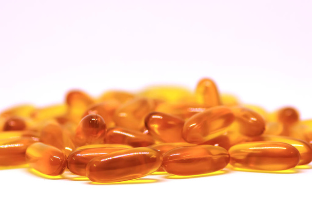 Cod liver oil omega 3 vitamin e gel capsules isolated on white background - Photo, Image