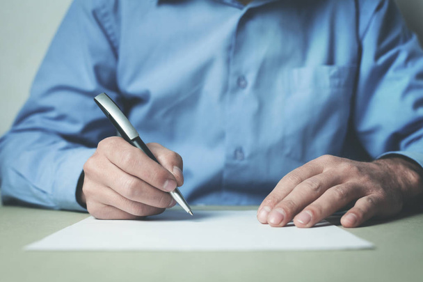 Businessman writing on a paper. - Foto, Imagem