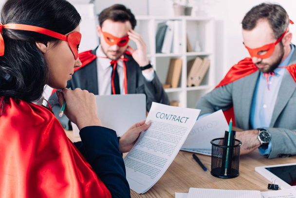 super businesspeople in masks and capes working in office - Photo, Image
