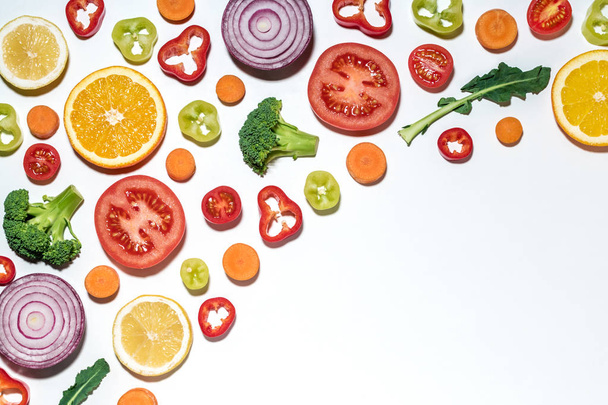 Assorted sliced vegetables and fruits on white background.  - Foto, Imagem