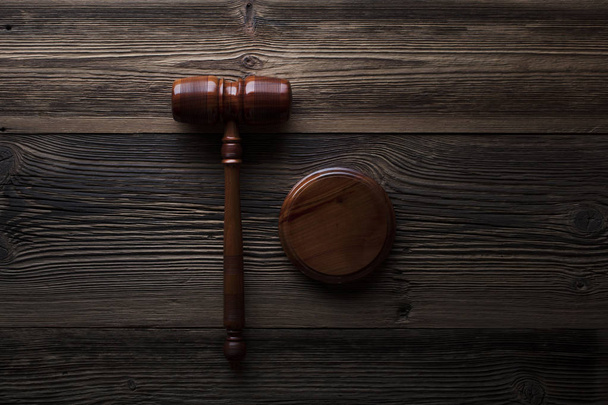 Law concept. Judges gavel on rustic wooden table. Top view. - Photo, Image