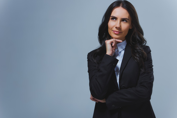 pensive attractive businesswoman looking away isolated on grey - Fotoğraf, Görsel