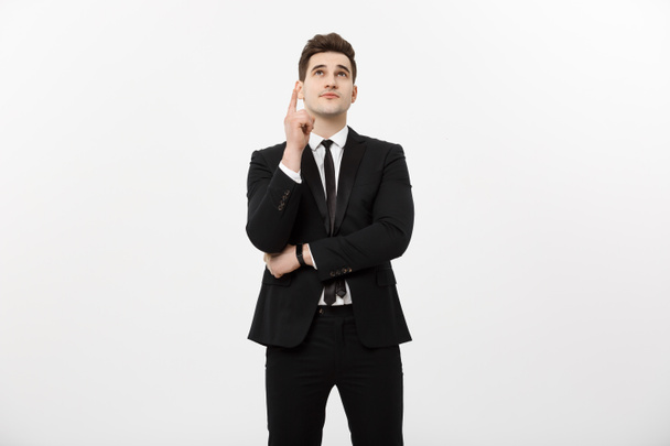 Conceito de negócio: Empresário bonito com um dedo apontado para cima isolado sobre fundo branco
 - Foto, Imagem