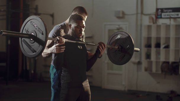 Black man working out with personal trainer - Photo, Image