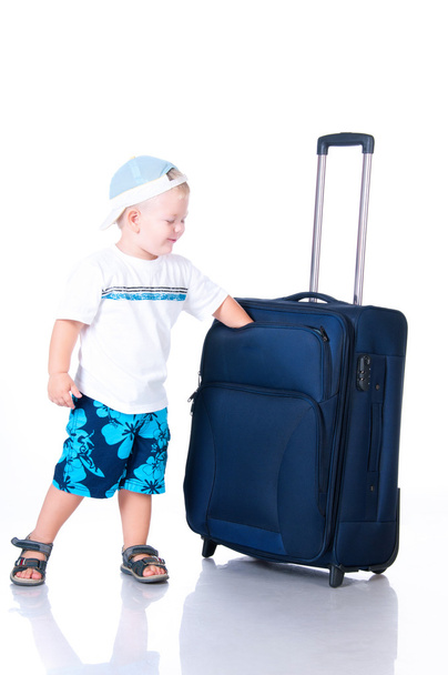 Small tourist with suitcase on white background - Foto, Imagem