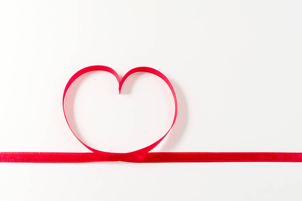 Heart made of ribbon on white background. Valentines day. - 写真・画像