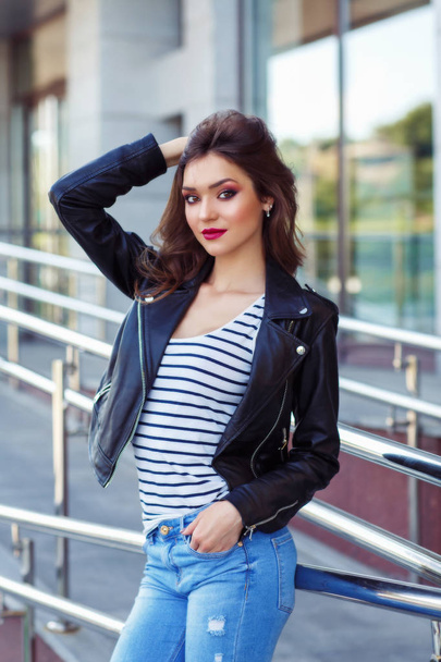 Young brunette girl wearing in stylish clothes smiling posing outdoors - Fotografie, Obrázek