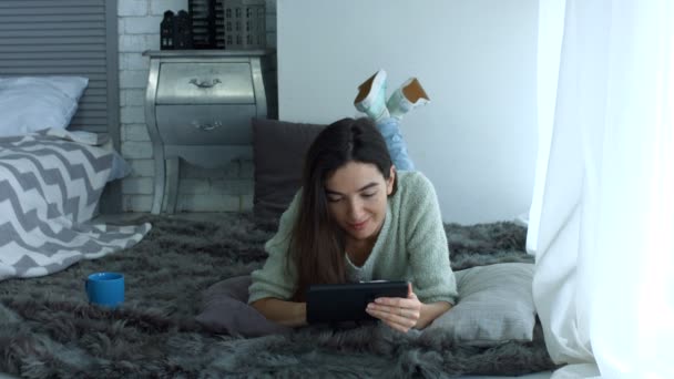 Charming woman networking with digital tablet - Felvétel, videó