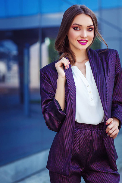 outdoor portrait of beautiful brunette woman in stylish business clothes - Photo, Image